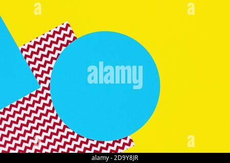 Abstract geometric fashion papers texture background in yellow, red, light blue colors. Top view, flat lay Stock Photo