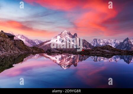 Sunset on lake Lac Blanc in France Alps. Monte Bianco mountains range glowing by sunset light on background Stock Photo
