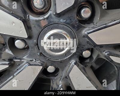 Close-up of logo for automobile manufacturer Nissan on vehicle hubcap, Walnut Creek, California, October 9, 2020. () Stock Photo