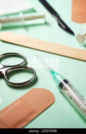 First aid kit on a green table. Stock Photo