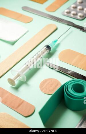 First aid kit on a green table. Stock Photo