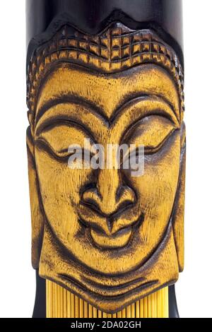close-up vertical view wooden face of buddha on white background Stock Photo