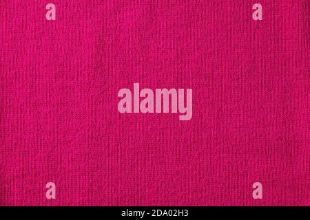 Bright pink knitted fabric background, copy space for text, top view Stock Photo