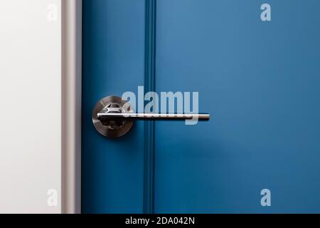 Blue colored door in modern design apartment Stock Photo