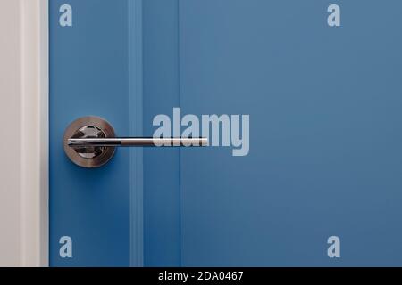 Blue colored door in modern design apartment Stock Photo