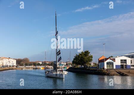 LES SABLES D'OLONNE, FRANCE - NOVEMBER 08, 2020: Jean Le Cam boat (Yes We Cam) in the channel for the start of the Vendee Globe 2020 Stock Photo