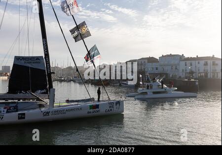 LES SABLES D'OLONNE, FRANCE - NOVEMBER 08, 2020: Jean Le Cam boat (Yes We Cam) in the channel for the start of the Vendee Globe 2020 Stock Photo