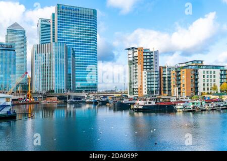 LONDON, UK - NOVEMBER 03, 2020: Modern skyscrapers of Canary Wharf, the financial hub in London seen across Blackwall Basin Stock Photo
