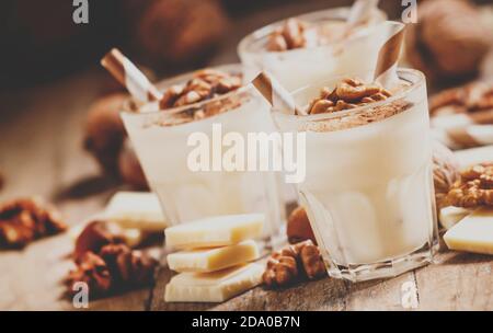 Dessert of white chocolate and walnuts, selective focus and toned image Stock Photo