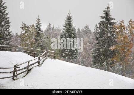 snowstorm over hills and meadows in rural Slovenia during autumn Stock Photo