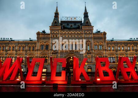 Moscow, Russia. 7th of November, 2020 Lettering reading 'Moscow' against the background of the GUM store building facade is seen in Red Square during a two-day exhibition of WWII installations marking the 79th anniversary of the 1941 Red Square Parade. The exhibition features military hardware and installations depict scene of daily life in Moscow during World War II Stock Photo