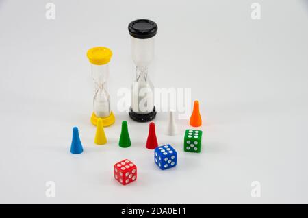 Game colored dice with an hourglass on white background Stock Photo