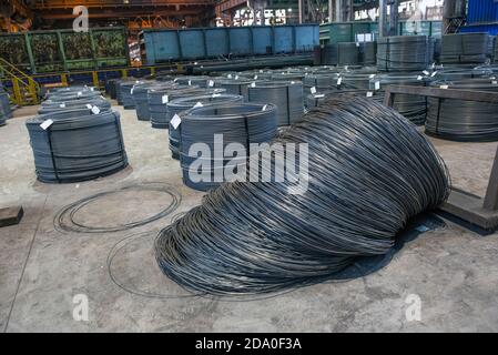 Steel sheets rolled up into rolls. Export Steel. Packing of steel for transportation. Stock Photo