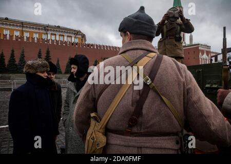 Moscow, Russia. 7th of November, 2020 Young people in period costume are seen in Red Square during a two-day exhibition of WWII installations marking the 79th anniversary of the 1941 Red Square Parade. The exhibition features military hardware and installations depict scene of daily life in Moscow during WWII, the mobilisation and the work done by Muscovites to defend the Russian capital, and scenes of WWII battles that took place near Moscow Stock Photo