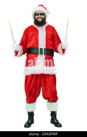 Santa with drumsticks. Arabic young Santa Claus with black beard holds drum stick on white background. Christmas coming Stock Photo