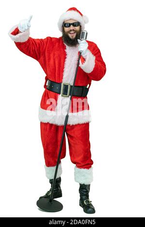 Santa with retro microphone. Santa Claus holds classic vintage microphone on white background. Christmas coming Stock Photo