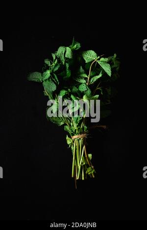 A bunch of fresh mint on black background Stock Photo