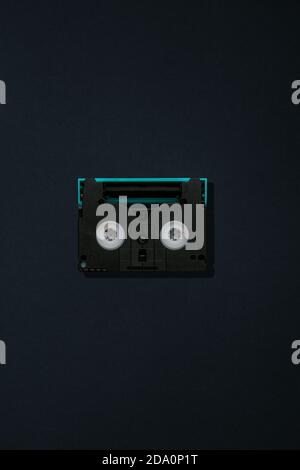 Top view of vintage compact audio tape on black background Stock Photo