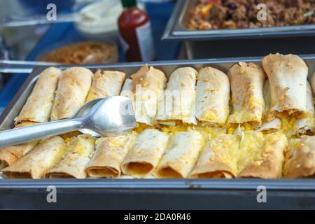 Pancakes stuffed with boiled corn. A tray with pancakes Stock Photo