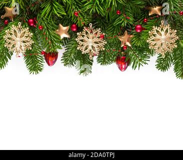Christmas border with fir branches and  baubles  isolated  on  white background . Flat lay. Stock Photo