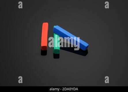 Red ,Green and Blue artists pastels on dark background Stock Photo