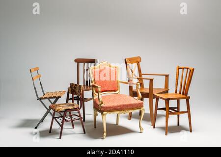 Studio shot of classical mixed chairs on neutral background Stock Photo