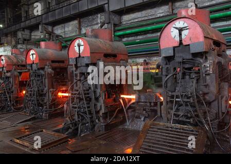 hot steel on conveyor in a steel mill. hot rolled rebar Stock Photo