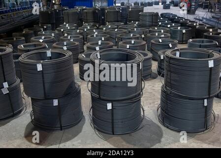 Steel sheets rolled up into rolls. Export Steel. Packing of steel for transportation. Stock Photo