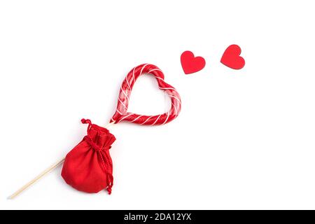 Red hearts, Lollipop and bag on a white background. Stock Photo