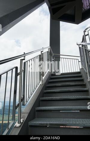 Stairway on the observation tower Uetliberg in Zurich, Switzerland, upward perspective. On both sides the stairs are bordered with solid metal railing Stock Photo