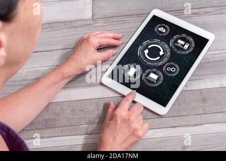 Woman using a tablet showing system update concept Stock Photo