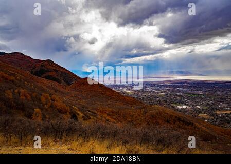 Storm clouds over the valley.  Gathering storm, starts to build as it approaches the mountainside to the east near Provo, Utah, USA. Stock Photo