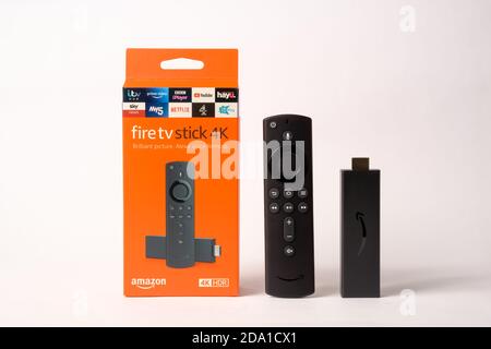 Stafford / United Kingdom - November 8 2020: Amazon Fire TV Stick 4K Ultra HD with Alexa Voice Remote. Product shot isolated on white. Stock Photo
