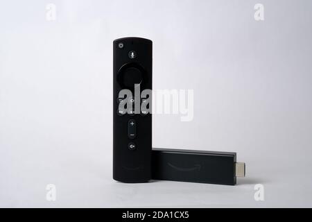 Stafford / United Kingdom - November 8 2020: Amazon Fire TV Stick 4K Ultra HD with Alexa Voice Remote. Product shot isolated on white. Stock Photo
