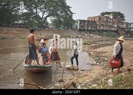 Mae Sot, Thailand. April 2012. Passenger boat crossing the river that serves as the border with Myanmar. Stock Photo