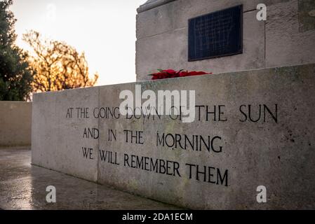 Sunrise on Remembrance Sunday 2020 at the Southend War Memorial with lines from Ode of Remembrance, from For the Fallen. And in the morning Stock Photo