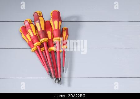 A set of a lot of different red tools for working include hammer screwdriver on gray background Stock Photo