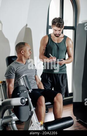 Leg day in gym Stock Photo