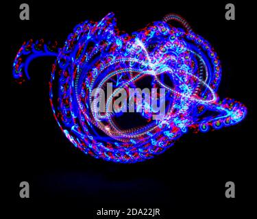 Light painting. Heart shape created by different light sources. Black background. Abstract, fun design Stock Photo