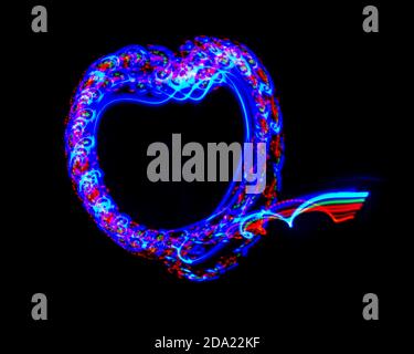 Light painting. Heart shape created by different light sources. Black background. Abstract, fun design Stock Photo