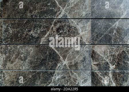 Marble natural texture background. Marble stone slabs lie in a row. Stock Photo