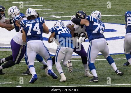 November 8, 2020, Indianapolis, Indiana, U.S: Indianapolis Colts running back Jordan Wilkins (20) runs between block from Indianapolis Colts offensive tackle Anthony Castonzo (74) and Colts center Ryan Kelly (78) during the game between the Baltimore Ravens and the Indianapolis Colts at Lucas Oil Stadium, Indianapolis, Indiana. (Credit Image: © Scott Stuart/ZUMA Wire) Stock Photo