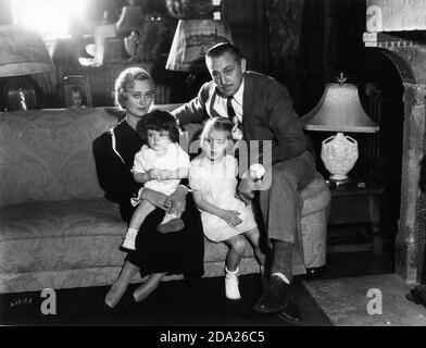 JOHN BARRYMORE with his 3rd wife DOLORES COSTELLO BARRYMORE at home in 1933 with their children JOHN BLYTH BARRYMORE and DOLORES ETHEL BARRYMORE  publicity photo from Universal Pictures Stock Photo