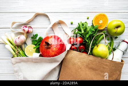 Zero waste shopping and sustanable lifestyle concept, various farm organic vegetables and fruits in reusable packaging supermarket bags. Copy space to Stock Photo