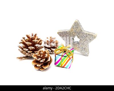 Pine cones and Christmas present isolated on white background Stock Photo