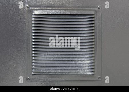 Metal grating in the door for air ventilation Stock Photo