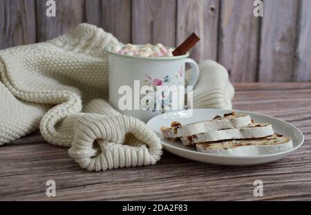 Autumn concept with white sweater coffee mug and cake on wooden background Stock Photo