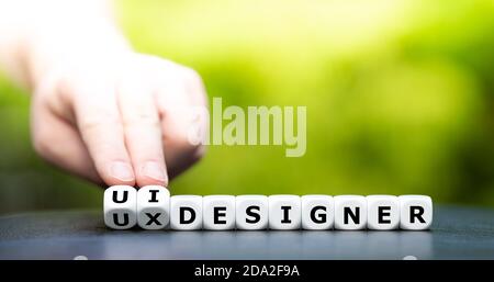Dice form the expressions " ui designer" and "ux designer". Stock Photo