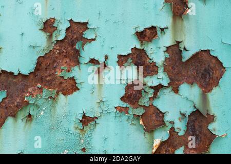 Rusty metal background with peeling paint, iron plate of an old locomotive Stock Photo
