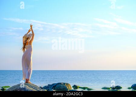 Slim woman in dress near sea Stock Photo